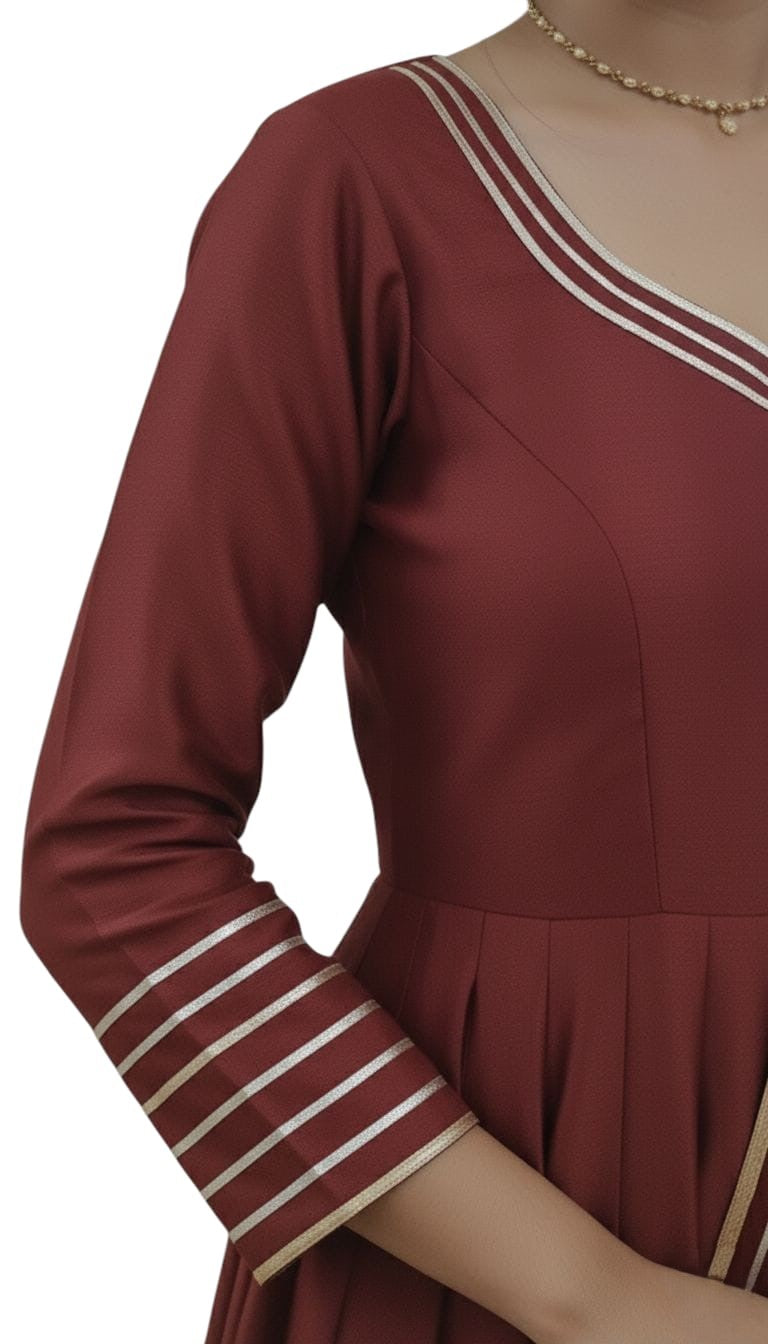 Close-up view of maroon shimmer fabric detailing on short Anarkali