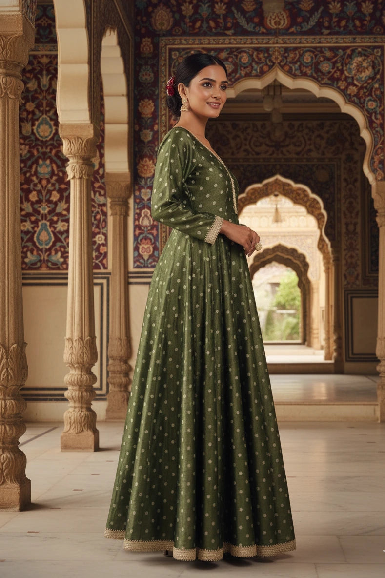 Dark green silk blend Anarkali gown for women with full sleeves and elegant design. Perfect Anarkali dress, green gown, party wear gown, and festive outfit.