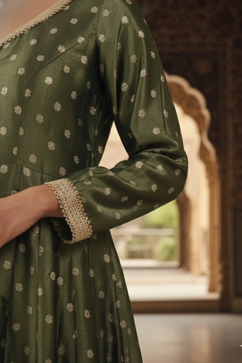 Dark green silk blend Anarkali gown for women with full sleeves and elegant design. Perfect Anarkali dress, green gown, party wear gown, and festive outfit.
