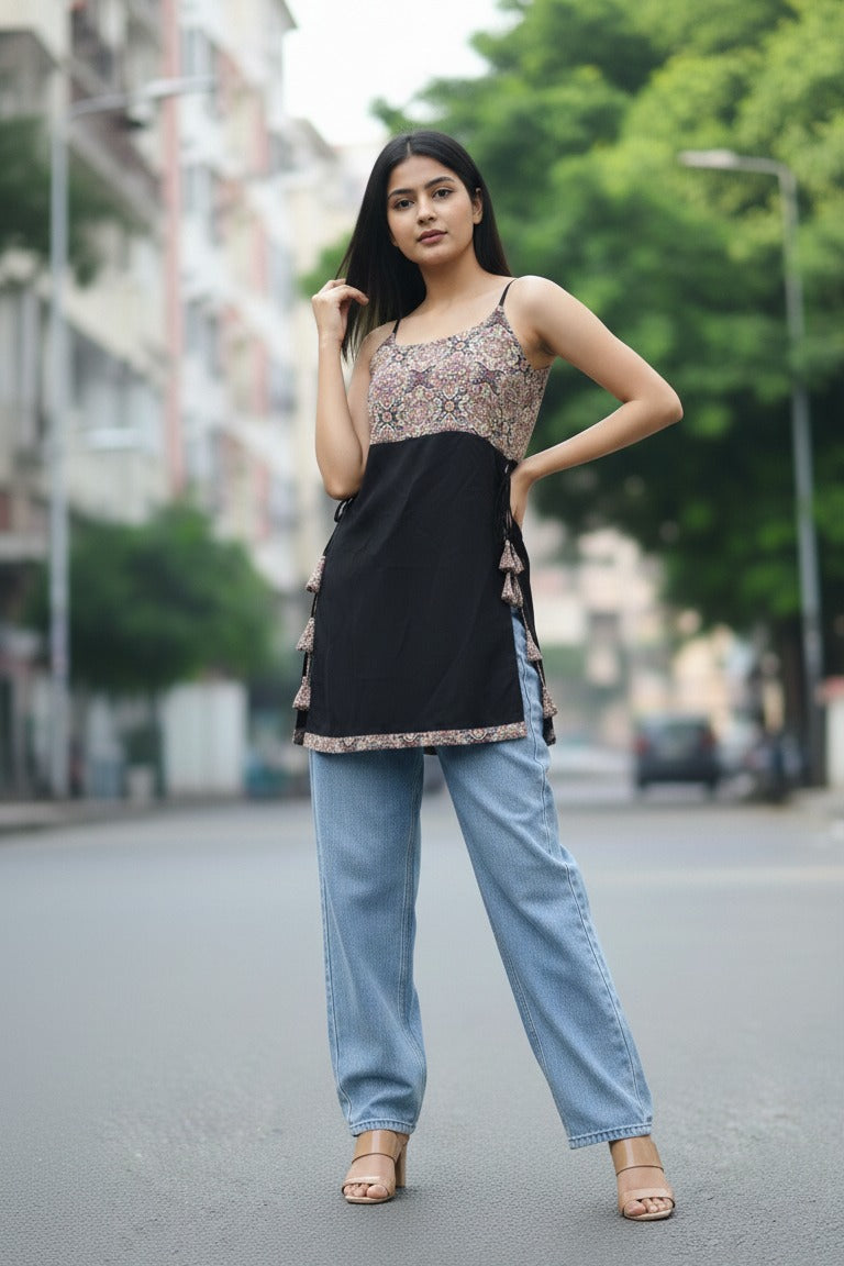 Floral sleeveless Nyra cut short kurti for women in soft cotton fabric. Stylish black cotton kurti, trending short kurta for women, perfect for daily and summer wear.