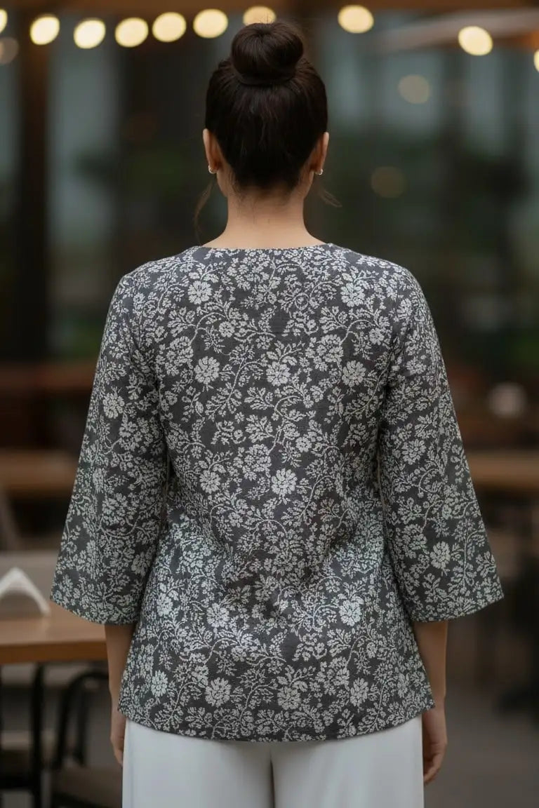 A stylish peplum top designed as a women floral top, perfect for pairing with blouses for women and ideal as trendy tank tops for women.- back zoom