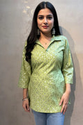 This green cotton kurti for women features a shirt collar, making it a perfect cotton kurti for women for office wear.
