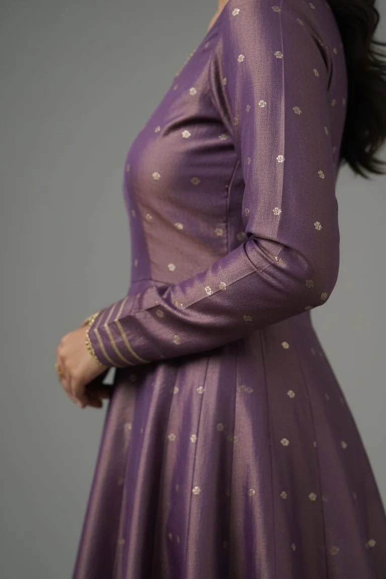 Purple Banarasi Anarkali gown for women with full sleeves and elegant design. Perfect reception gown, one piece gown, designer dress, and stylish ladies gown for special occasions.