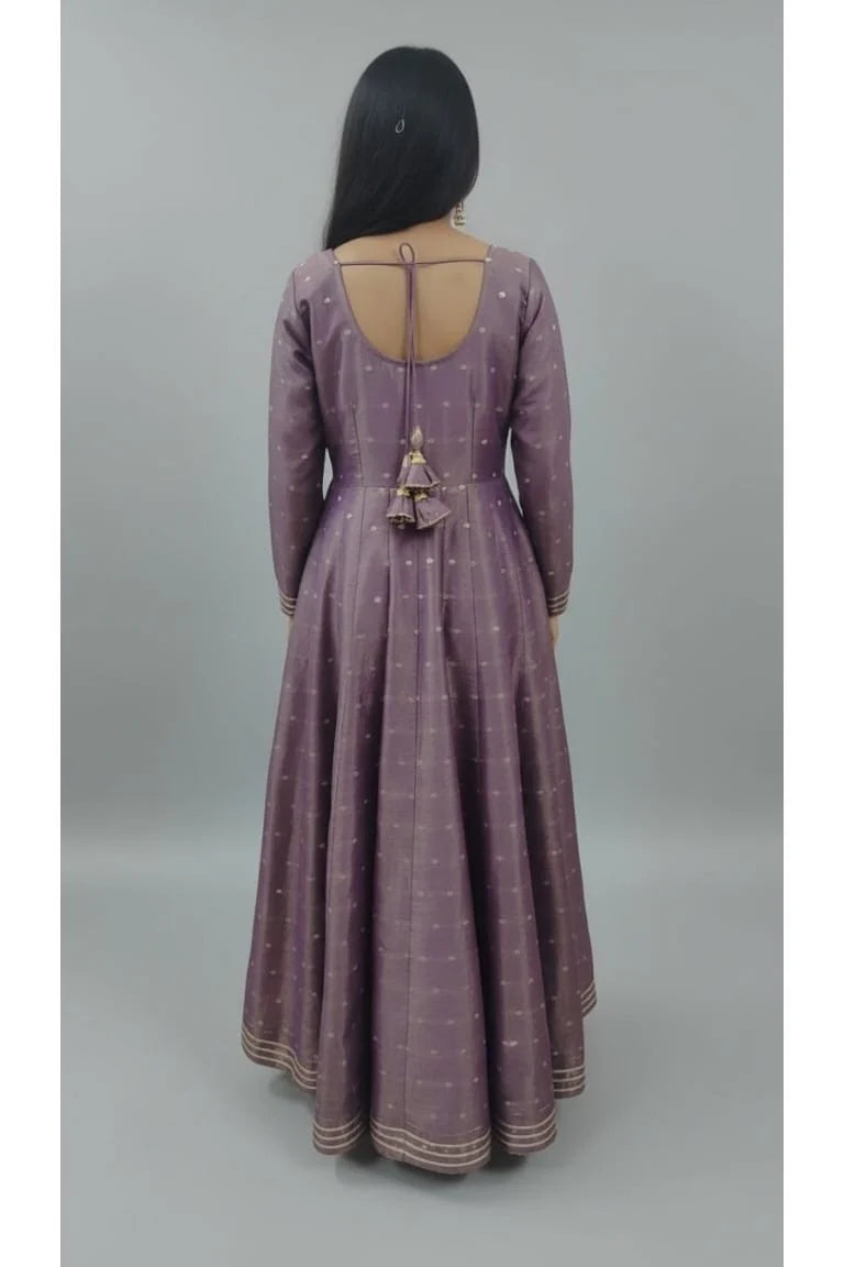 Purple Banarasi Anarkali gown for women with full sleeves and elegant design. Perfect reception gown, one piece gown, designer dress, and stylish ladies gown for special occasions.