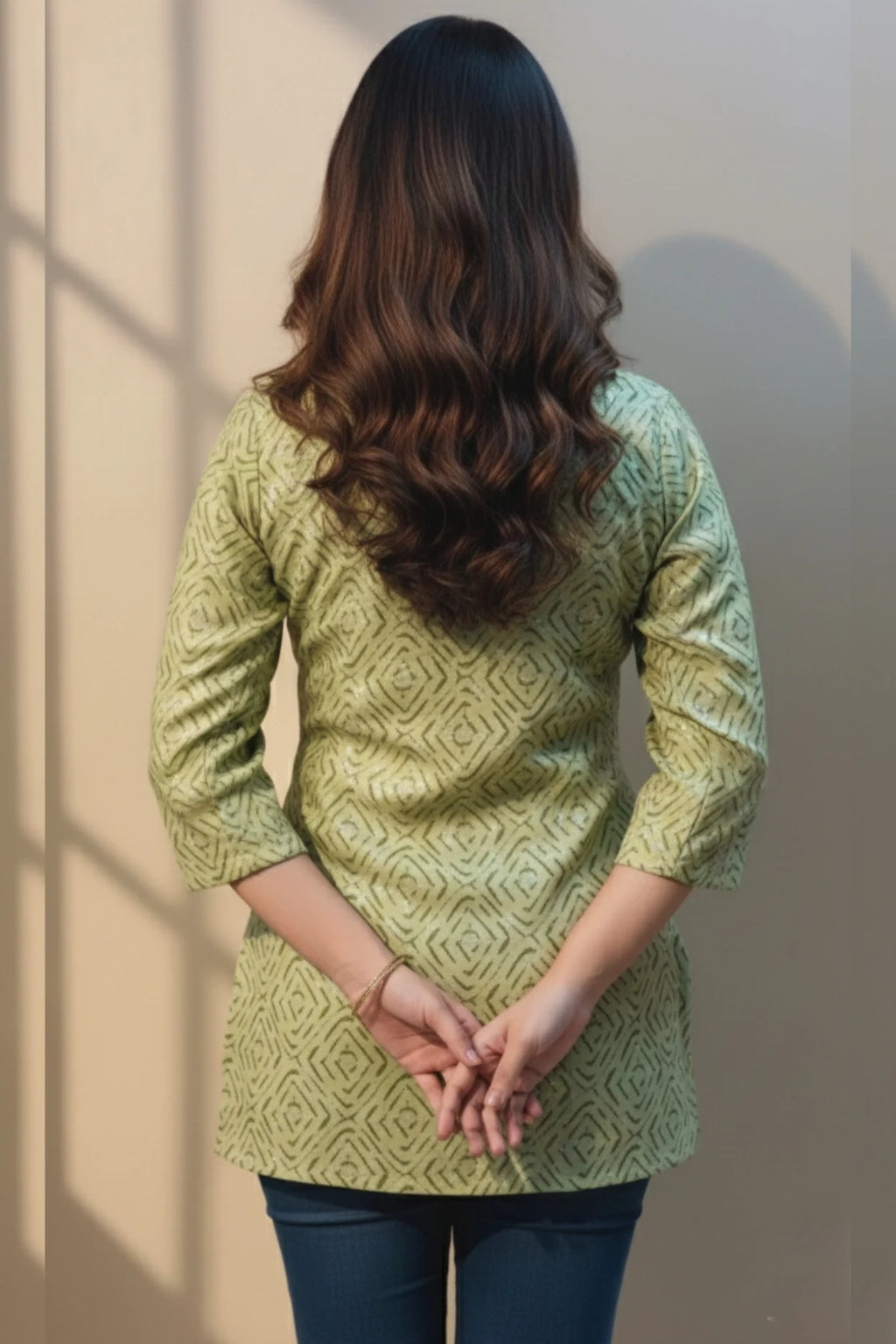 A stylish short kurti for women cotton with a geometric print. This green kurti is ideal for casual outings and daily wear.