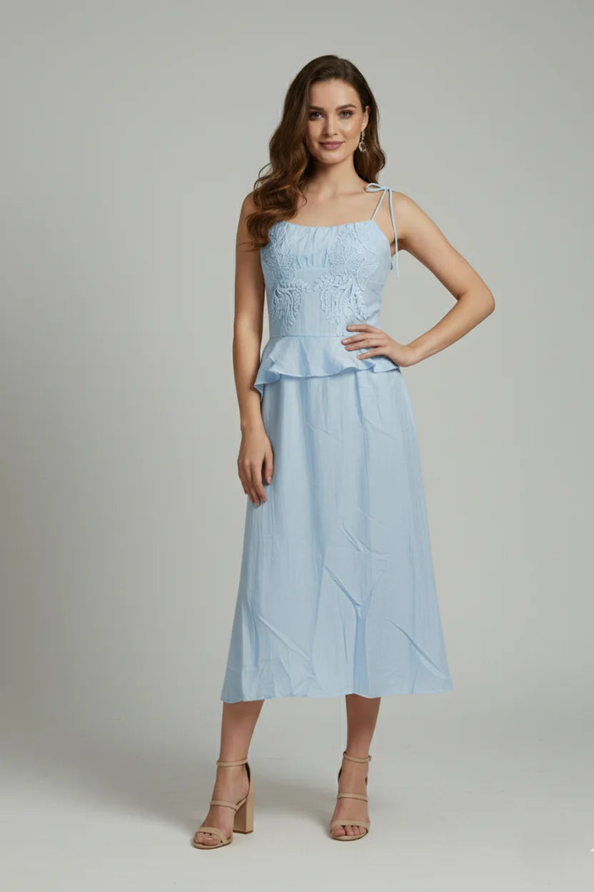 This sleeveless design with shoulder tie straps makes for the perfect midi sundress. Lightweight, breathable fabric for tropical getaways.