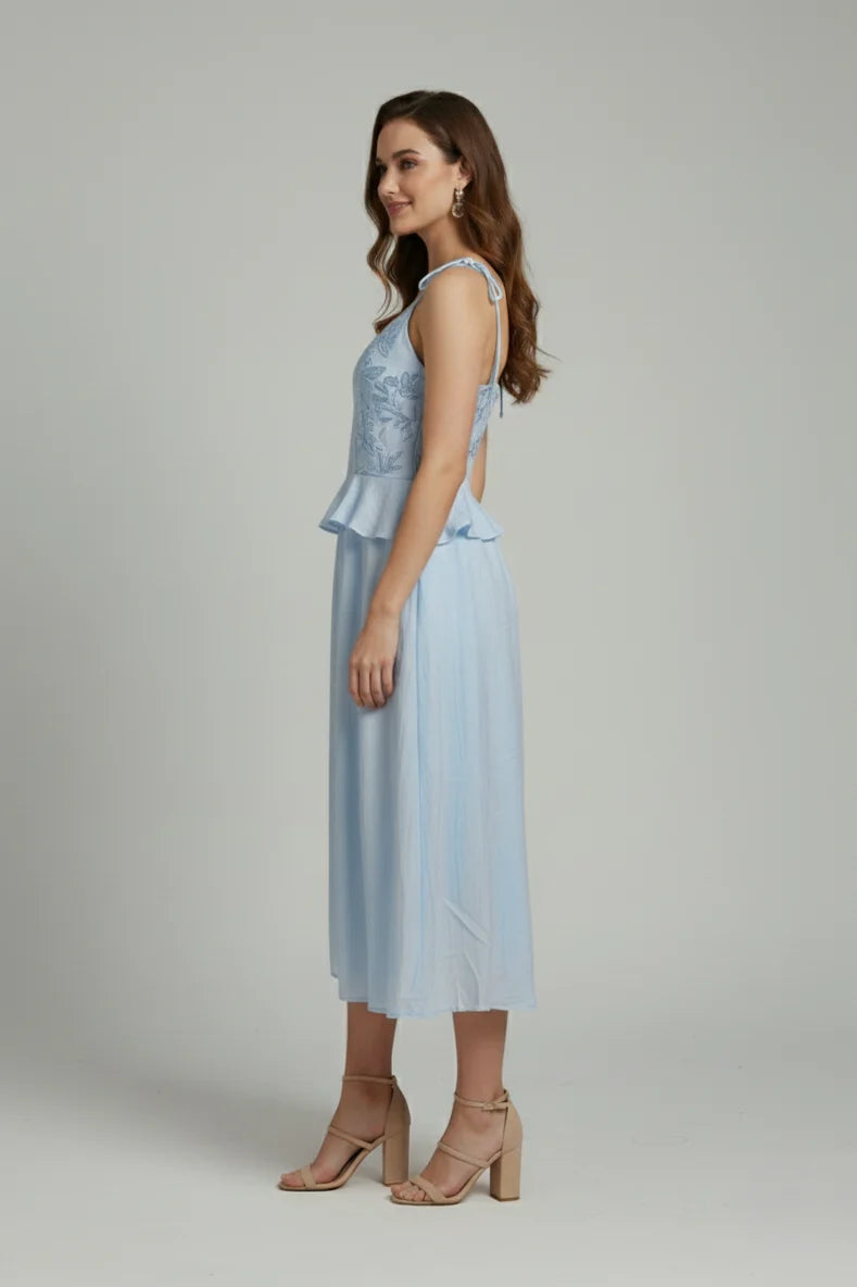 Perfect for special occasions, this embroidered bodice dress offers a premium look and a flattering peplum waist.
