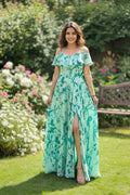 Green floral maxi dress for women made from lightweight georgette, featuring a sleeveless design and knee cut style. Perfect for summer outings, casual events, and stylish everyday wear.