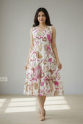Elegant white floral print cotton dress for women featuring a sleeveless design and stylish V-neck. Lightweight and breathable, perfect for summer wear, casual outings, and everyday comfort.
