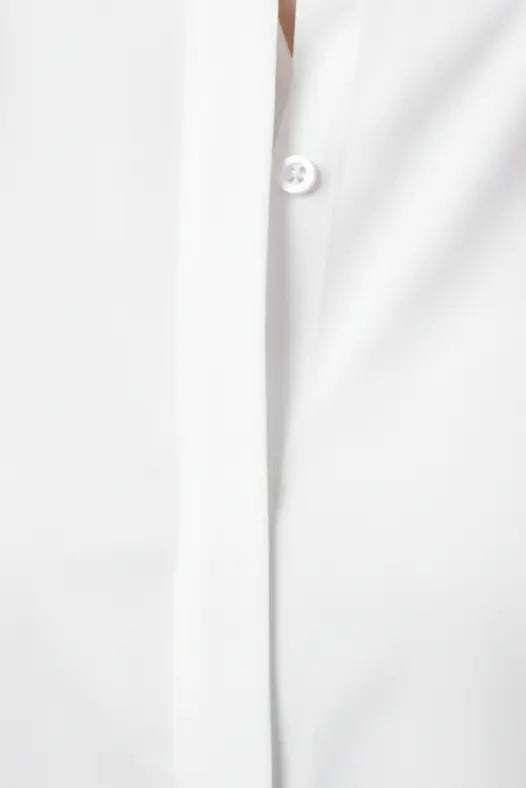 Women’s white cotton shirt featuring a classic spread collar and full sleeves, perfect for formal wear and party wear, elegant white party wear shirt suitable for office and casual styling, premium white formal shirt for women.