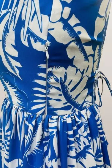 Stylish blue floral printed maxi dress for women featuring a long length, sleeveless design, and scoop neck. Perfect for casual wear, summer outings, and comfortable everyday fashion.