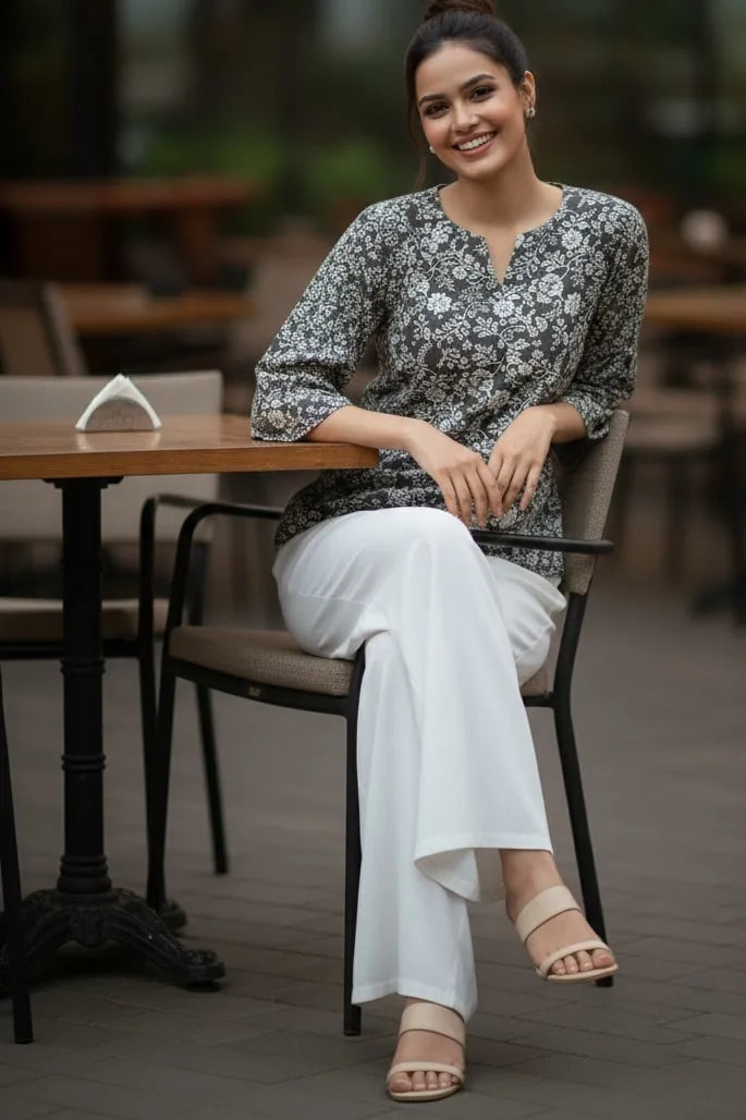 A stylish peplum top designed as a women floral top, perfect for pairing with blouses for women and ideal as trendy tank tops for women.- view