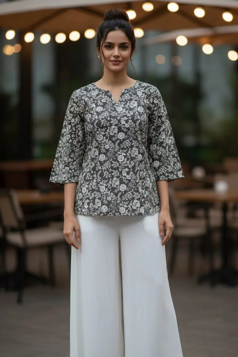 A stylish peplum top designed as a women floral top, perfect for pairing with blouses for women and ideal as trendy tank tops for women.- front